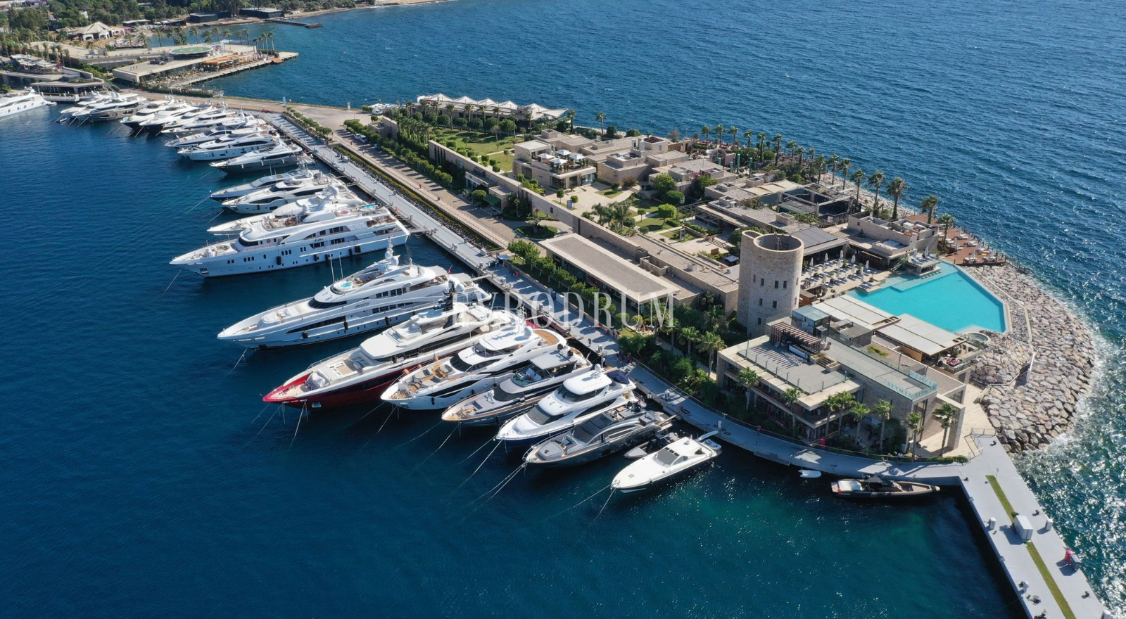 Superyachts at Yalıkavak’s Palmarina, with clear turquoise water