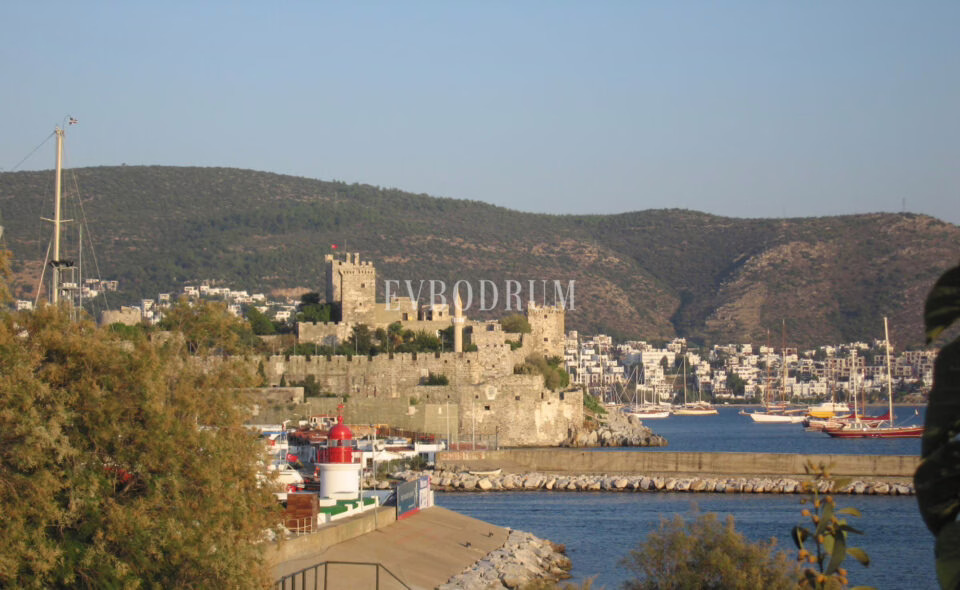 St Peter’s Castle and the harbour entrance with moored boats