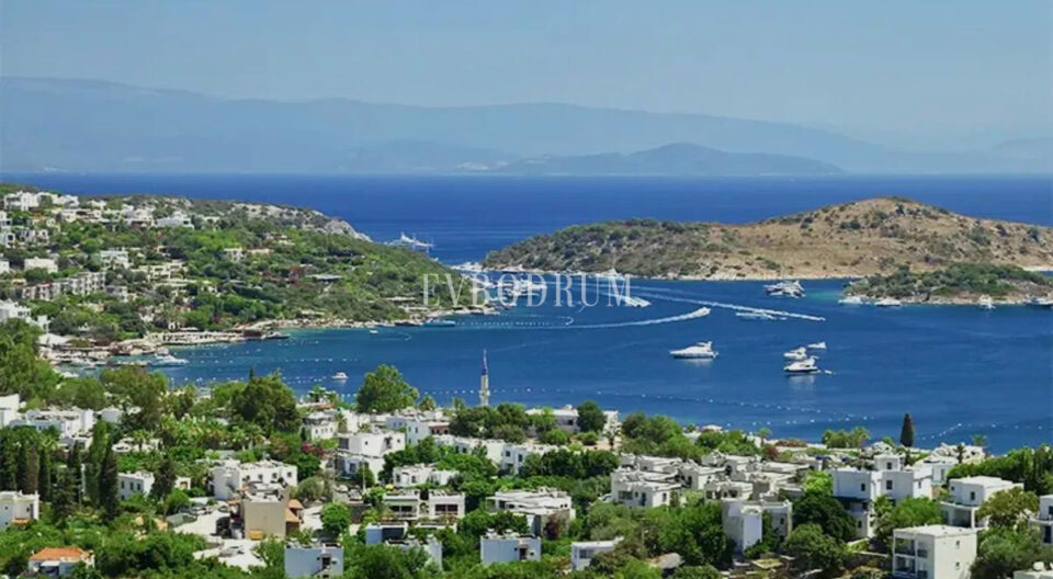 Türkbükü bay: turquoise water, pine-covered hills and white villas on the slope